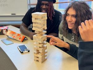 Student Group1 participate in Jenga game to learn about project management